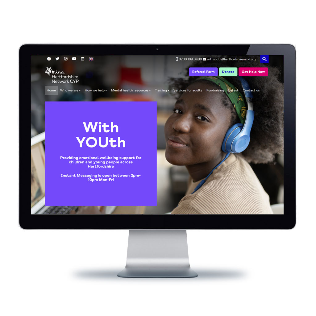 Image of With Youth website displayed on a computer monitor